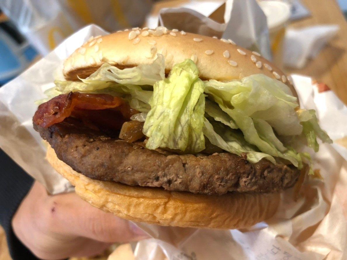 The 1955 burger wrapped in branded McDonald's Korea paper.